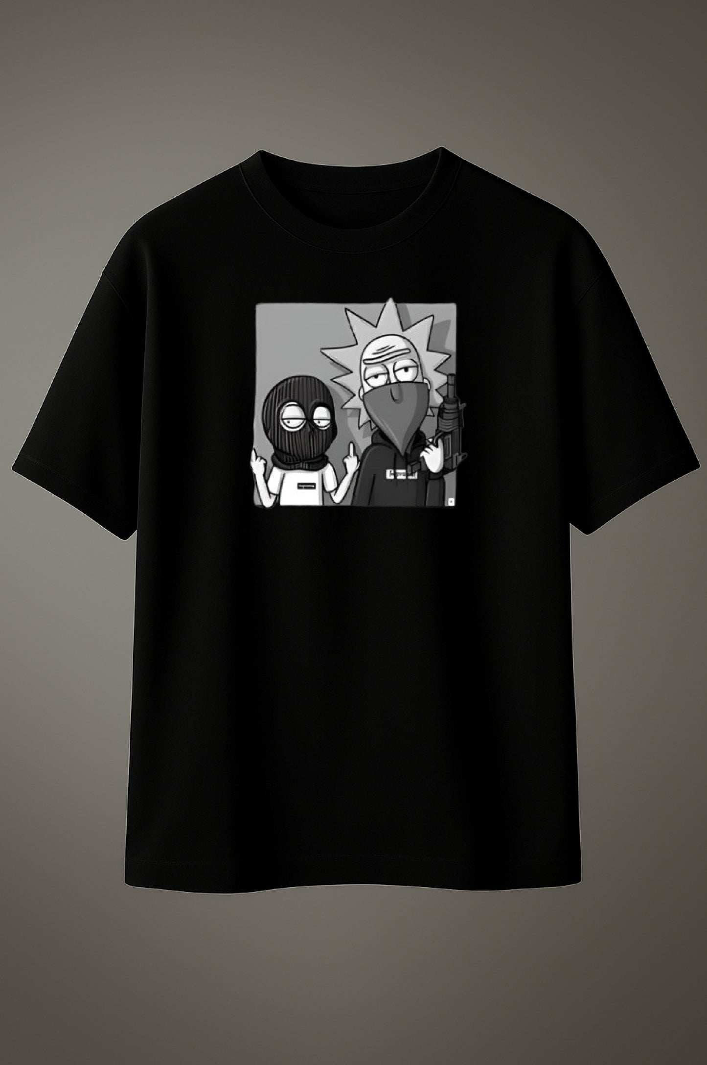 Black t-shirt with cartoon graphic on a gray background