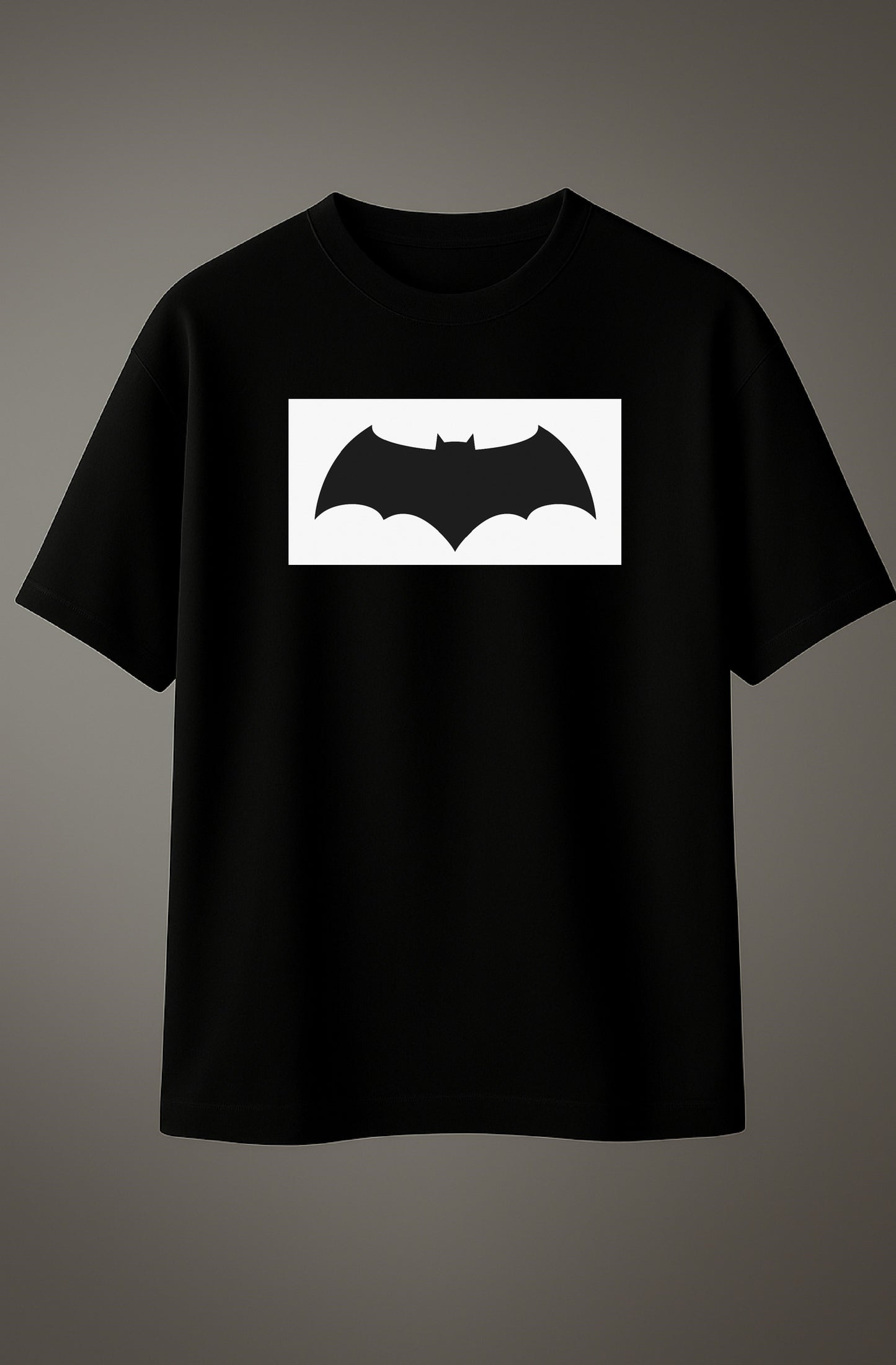 Black oversized T-shirt with Batman logo graphic printed on the chest.