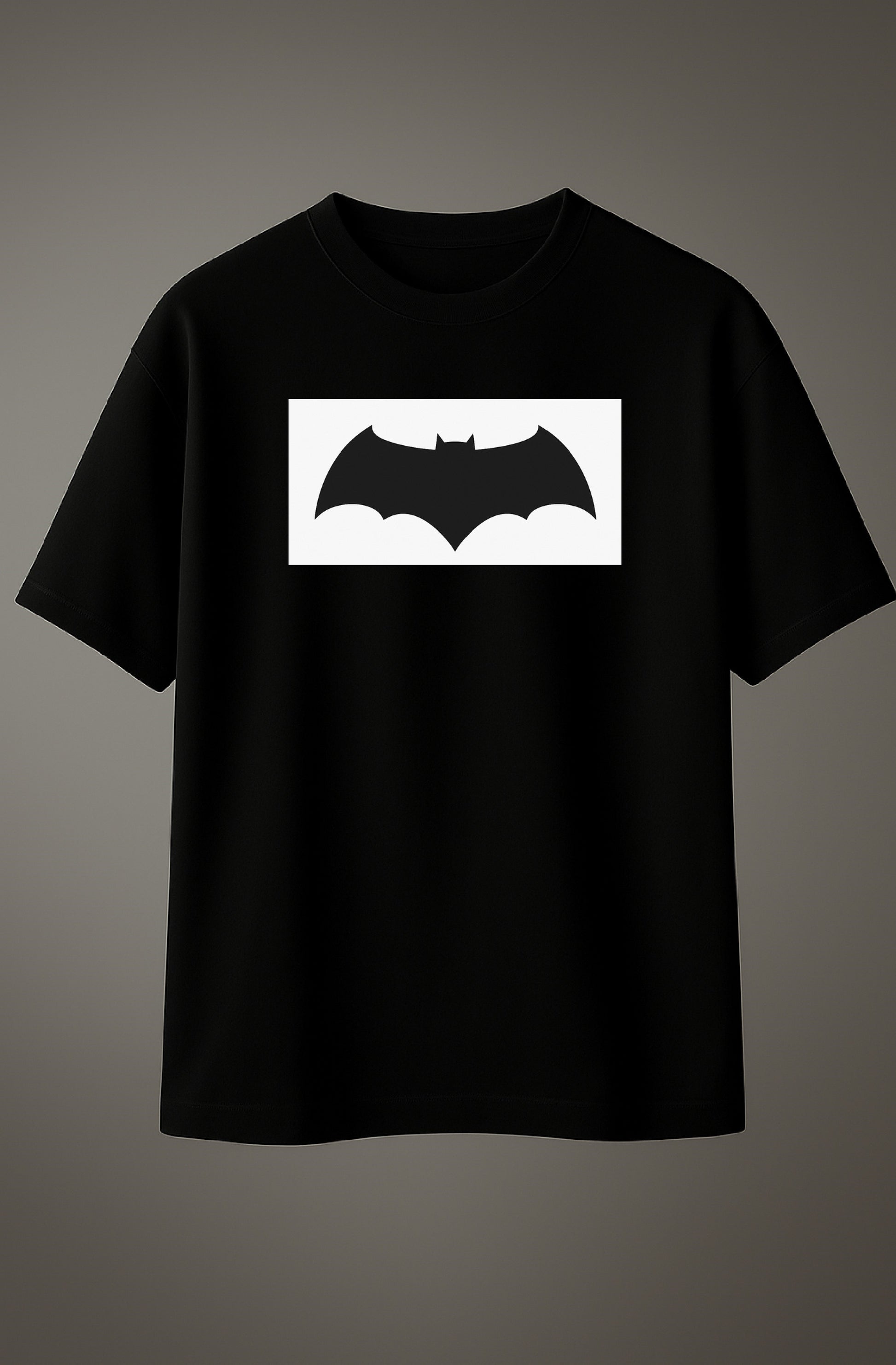 Black oversized T-shirt with Batman logo graphic printed on the chest.