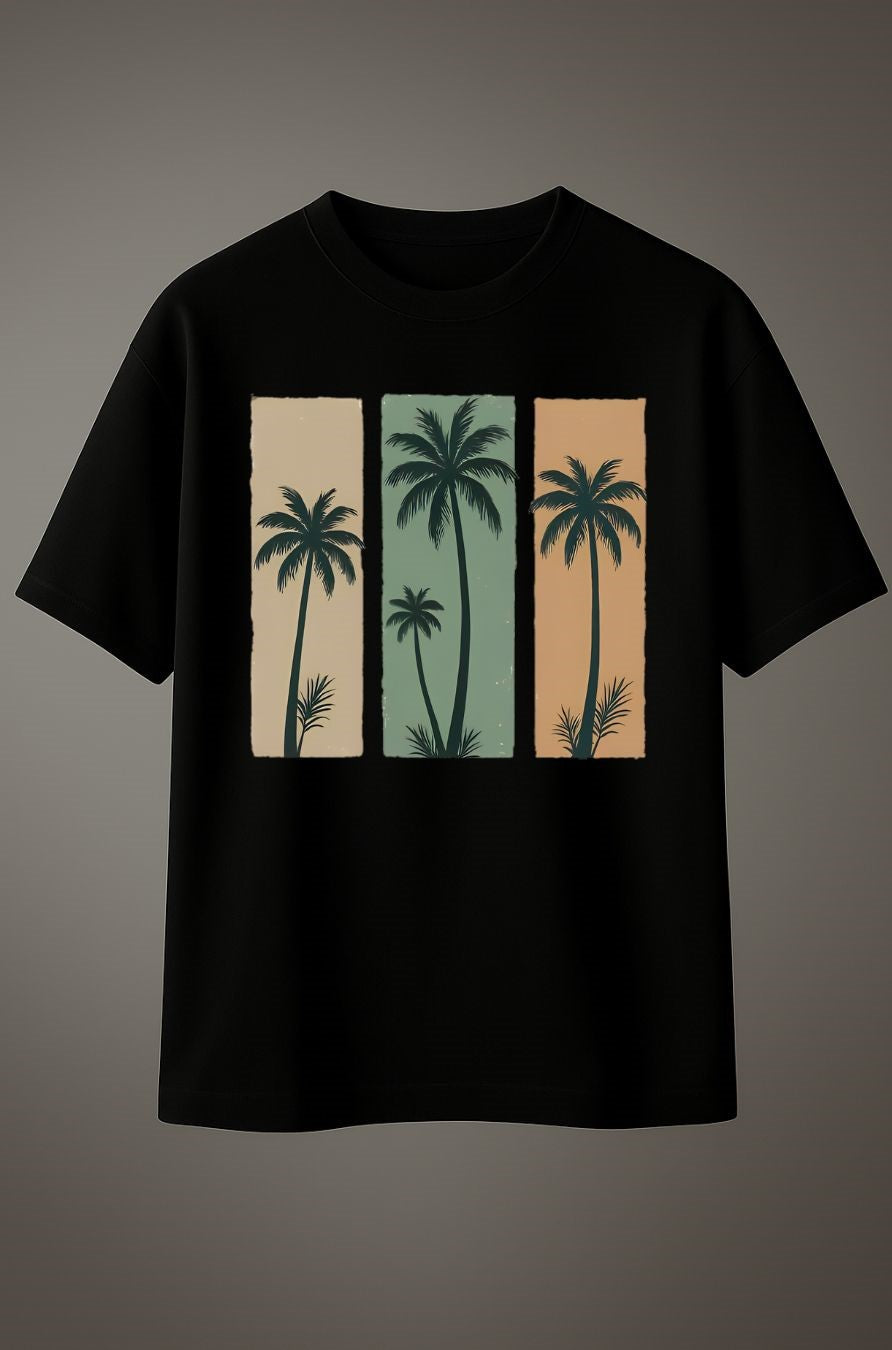 Black cotton T-shirt with tropical palm tree graphic print in beige, green, and orange panels.