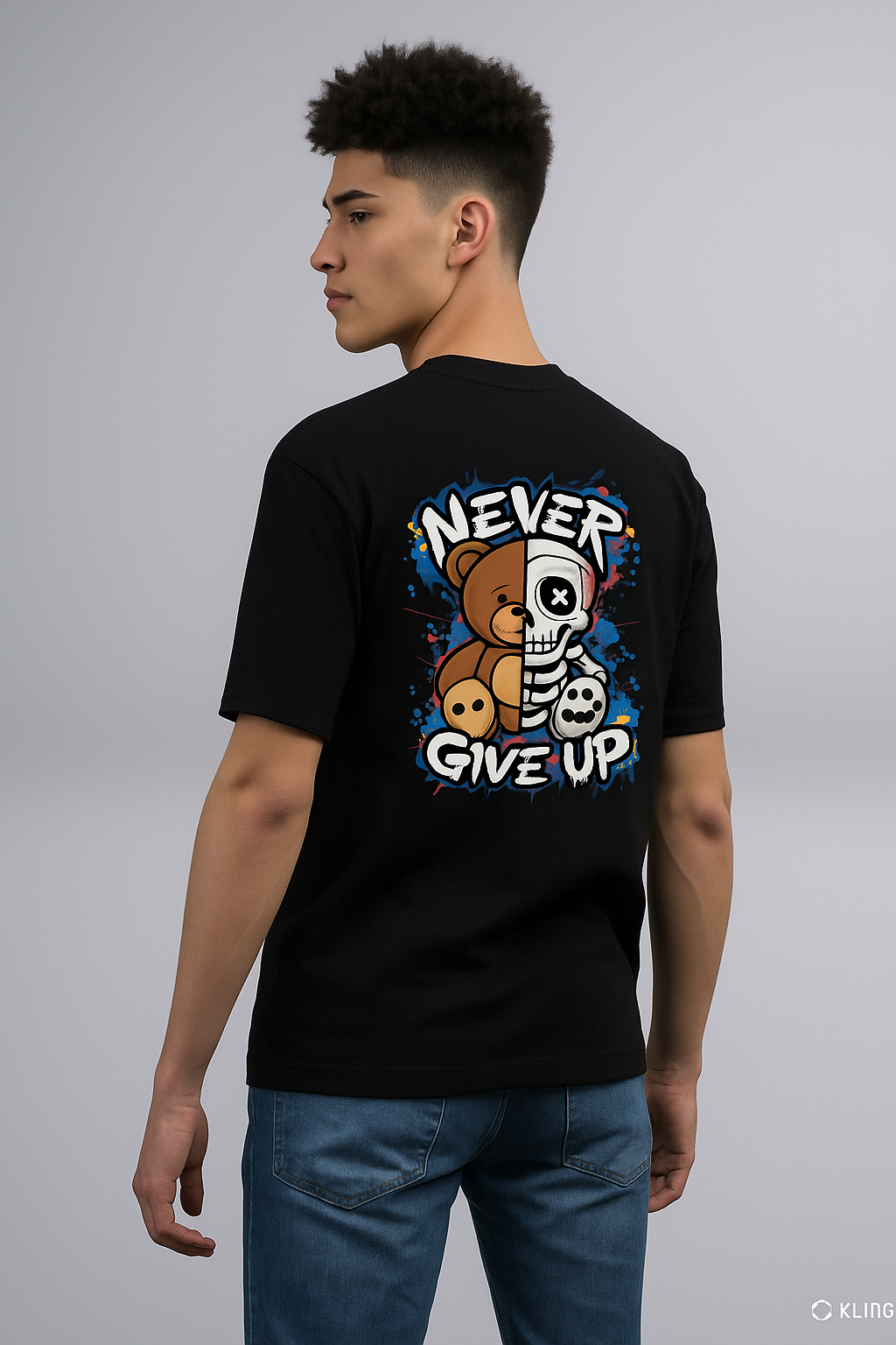 Person wearing a black t-shirt with a graphic design on the back, featuring a bear and skull, with text 'Never Give Up'.